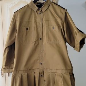 Burberry shirt with roll up sleeves and pleated bottom. Metallic fabric.